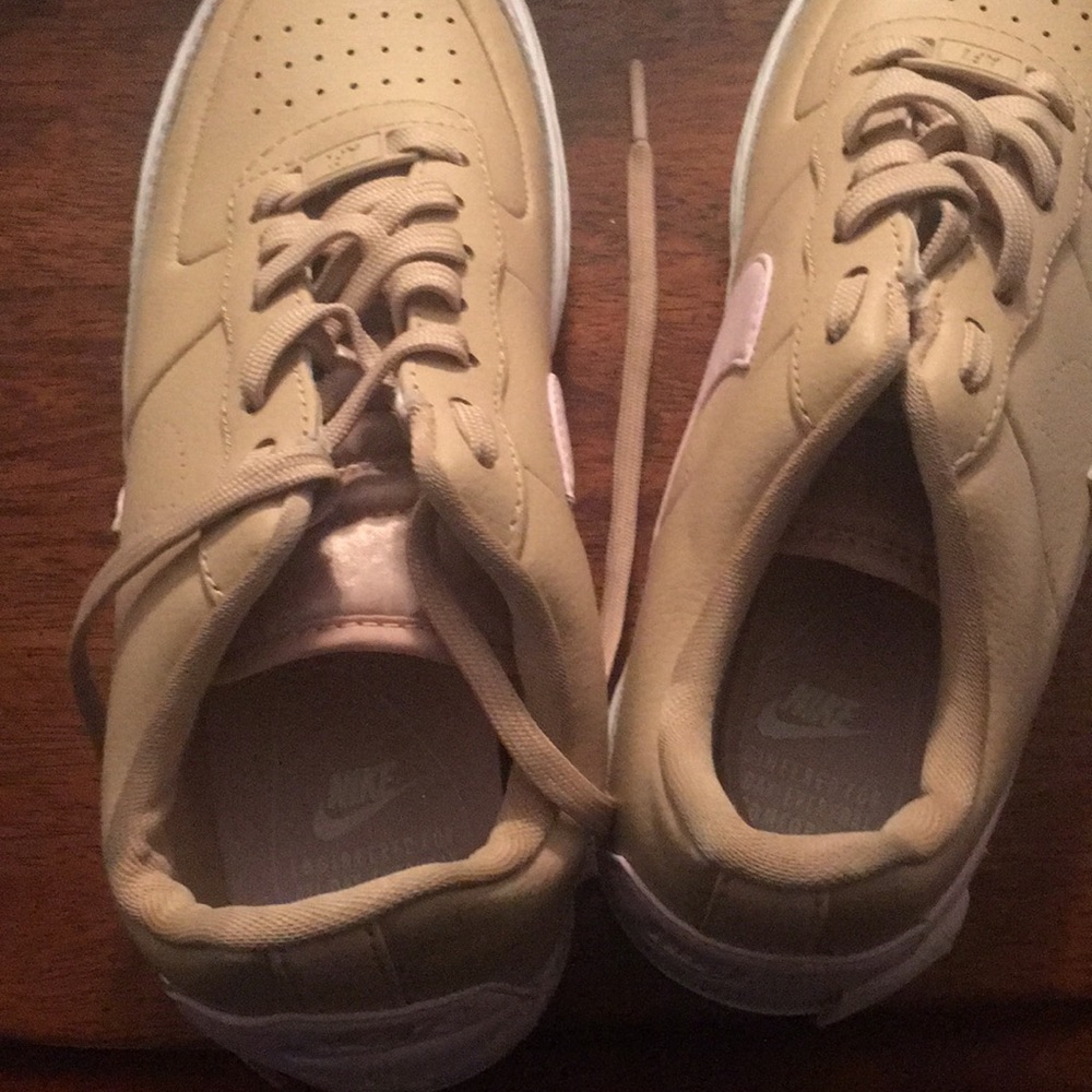 Nike’s beige and pink